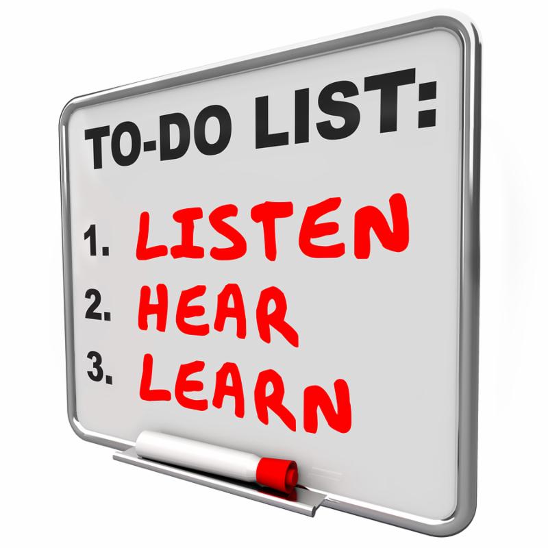 Listen, Hear and Learn words written on a dry erase board to illustrate knowledge, understanding and paying attention to others